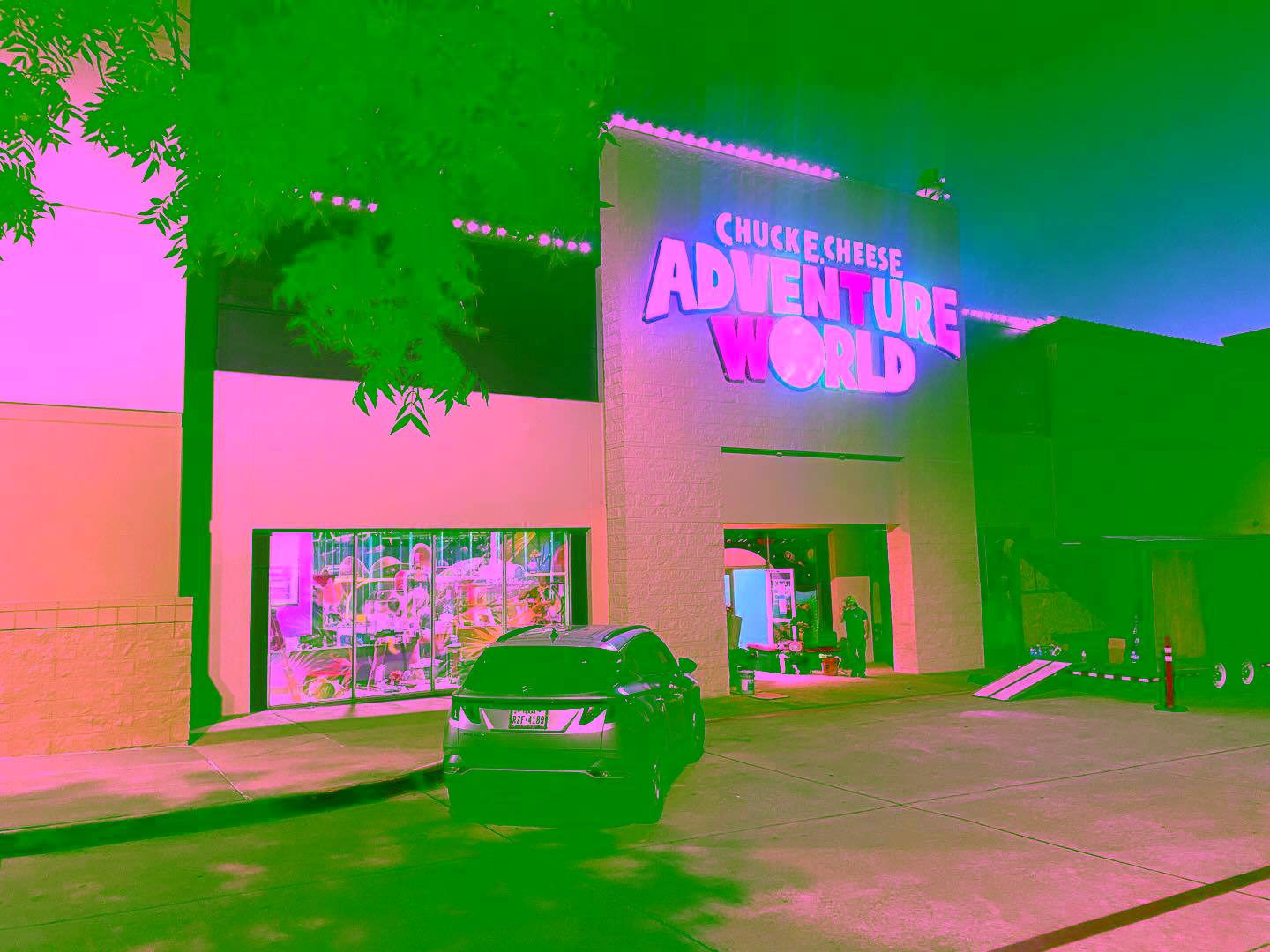 Exterior of Adventure World at night
