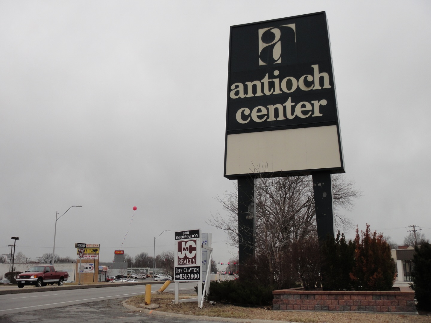 Exterior of Antioch Center and Chuck E. Cheese's during demolition.