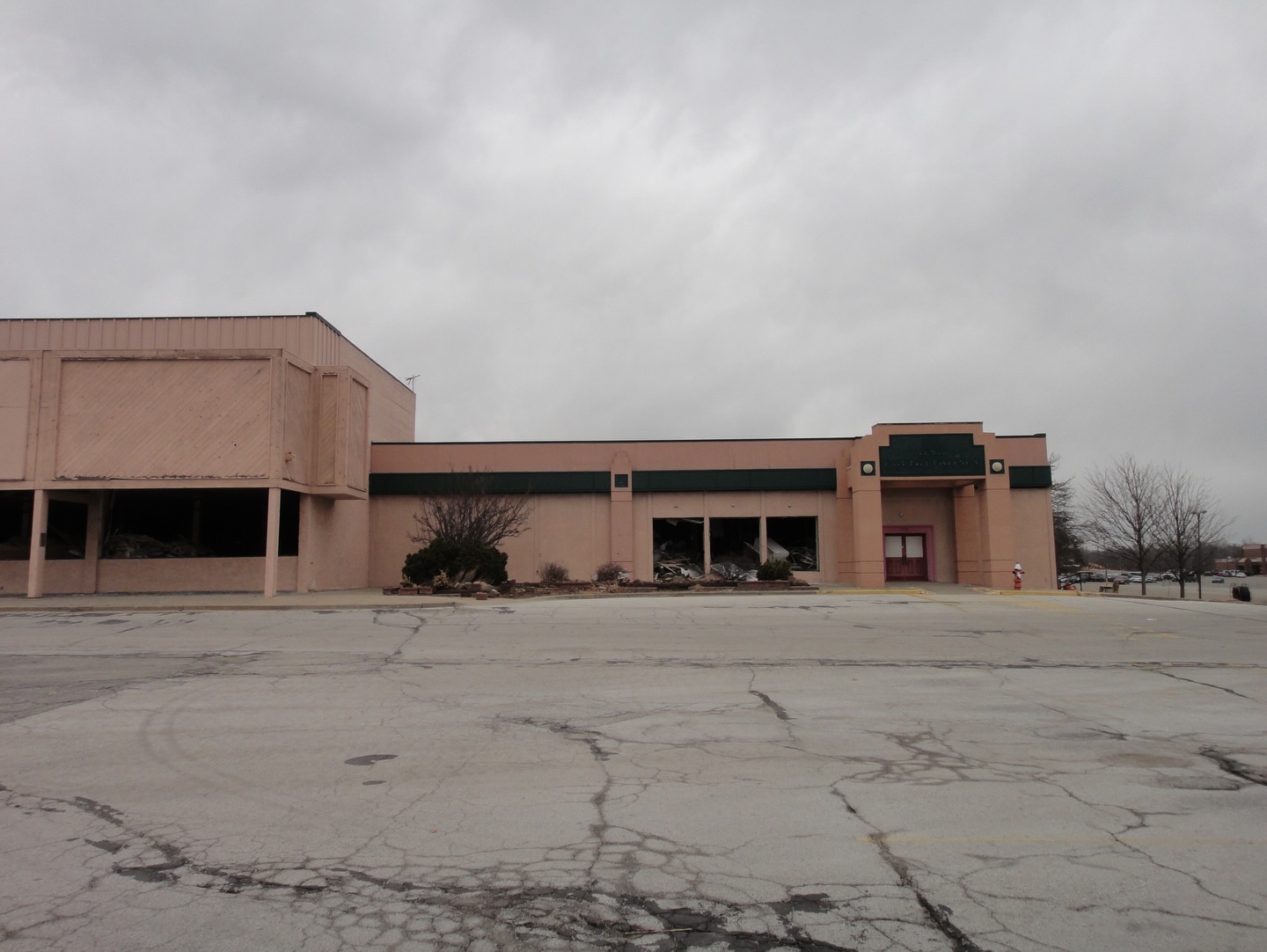 Exterior of Antioch Center and Chuck E. Cheese's during demolition.