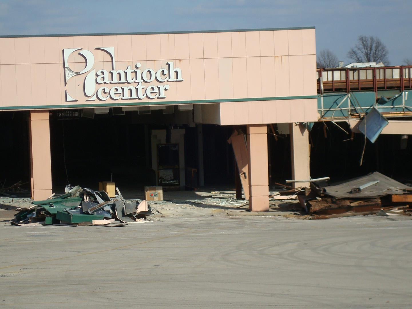 Exterior of Antioch Center and Chuck E. Cheese's during demolition.