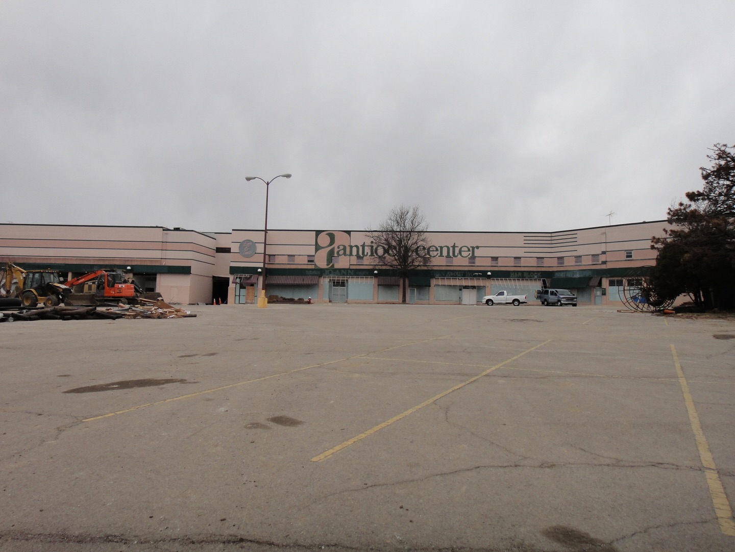 Exterior of Antioch Center and Chuck E. Cheese's during demolition.